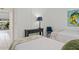 Bedroom with twin beds, balcony access, and modern decor at 1531 Placida Rd # 1-103, Englewood, FL 34223