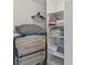 Closet with shelves and hanging space, plus a roll-away bed at 1531 Placida Rd # 1-103, Englewood, FL 34223