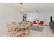 Charming dining area with glass-top table and chairs at 1531 Placida Rd # 1-103, Englewood, FL 34223
