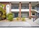 Brick building exterior with balconies and landscaping at 1531 Placida Rd # 1-103, Englewood, FL 34223