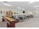 Community room with shuffleboard and tables at 1531 Placida Rd # 1-103, Englewood, FL 34223