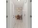 Hallway with tile floors and view of dining area at 1531 Placida Rd # 1-103, Englewood, FL 34223