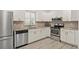 Modern kitchen featuring stainless steel appliances at 1531 Placida Rd # 1-103, Englewood, FL 34223