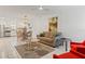 Bright living room with comfy seating and a large window at 1531 Placida Rd # 1-103, Englewood, FL 34223
