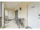 Small patio with table and chairs, plus a bicycle at 1531 Placida Rd # 1-103, Englewood, FL 34223