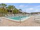 Community pool with lounge chairs at 1531 Placida Rd # 1-103, Englewood, FL 34223