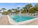Inviting community pool with plenty of lounge chairs at 1531 Placida Rd # 1-103, Englewood, FL 34223
