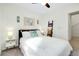 Serene bedroom with nautical decor, a ceiling fan and natural light at 1920 Sunset Preserve Way, Port Charlotte, FL 33953