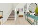 Bright foyer featuring wood floors, a staircase and stylish decorations at 1920 Sunset Preserve Way, Port Charlotte, FL 33953