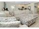 Spacious living room with a large sectional sofa and ottoman at 1920 Sunset Preserve Way, Port Charlotte, FL 33953