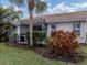 Private screened patio with lush landscaping, perfect for relaxing at 1931 San Silvestro Dr, Venice, FL 34285