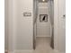 Inviting hallway featuring neutral decor and access to other rooms at 1931 San Silvestro Dr, Venice, FL 34285