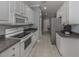 Bright kitchen featuring ample cabinetry, granite counters, and a view into an adjacent room at 1931 San Silvestro Dr, Venice, FL 34285