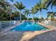 Community pool with lounge chairs and patio area at 1931 San Silvestro Dr, Venice, FL 34285
