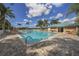 Inviting community pool with lounge chairs and patio at 1931 San Silvestro Dr, Venice, FL 34285