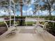Spacious screened porch overlooking a tranquil lake at 1931 San Silvestro Dr, Venice, FL 34285
