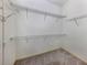 Large walk-in closet with wire shelving providing ample storage at 1931 San Silvestro Dr, Venice, FL 34285