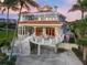 Luxury home with large balconies and circular driveway at 213 The Esplanade S, Venice, FL 34285
