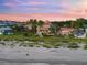 Luxury beachfront home at sunset, with ocean views at 213 The Esplanade S, Venice, FL 34285
