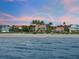 Beachfront property showcasing a large house and surrounding landscape at 213 The Esplanade S, Venice, FL 34285
