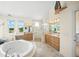 Large bathroom with corner shower and double vanities at 213 The Esplanade S, Venice, FL 34285
