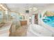 Spacious bathroom with a large shower and a soaking tub at 213 The Esplanade S, Venice, FL 34285