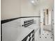 Bathroom with black and white tile and built-in shelving at 213 The Esplanade S, Venice, FL 34285