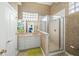 Bathroom with shower, vanity, and a large mirror at 213 The Esplanade S, Venice, FL 34285