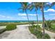 Scenic beach access path, leading to the sandy shore at 213 The Esplanade S, Venice, FL 34285
