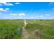 Pathway to beach with Stay on Path sign at 213 The Esplanade S, Venice, FL 34285