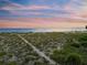 Scenic beach landscape with grassy dunes at 213 The Esplanade S, Venice, FL 34285