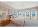 Bedroom with playful decor and ocean views at 213 The Esplanade S, Venice, FL 34285