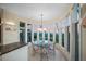 Bright breakfast nook with ocean views and seating for six at 213 The Esplanade S, Venice, FL 34285