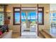 Grand entryway with double doors and ocean views at 213 The Esplanade S, Venice, FL 34285