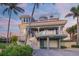 Stunning waterfront home with unique architectural details and a large balcony at 213 The Esplanade S, Venice, FL 34285