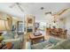 Open living room with fireplace and seating area overlooking ocean at 213 The Esplanade S, Venice, FL 34285