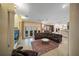 Spacious living room with a fireplace and access to the oceanfront patio at 213 The Esplanade S, Venice, FL 34285