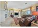 Spacious living room boasts a fireplace and ocean views at 213 The Esplanade S, Venice, FL 34285
