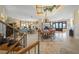 Open living and dining area with hardwood floors and staircase at 213 The Esplanade S, Venice, FL 34285