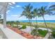 Oceanfront view from a home's balcony with terracotta roof tiles at 213 The Esplanade S, Venice, FL 34285