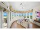 Relaxing room with ocean view, comfy seating, and hardwood floors at 213 The Esplanade S, Venice, FL 34285