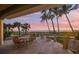 Ocean view patio with seating for six, perfect for sunset dinners at 213 The Esplanade S, Venice, FL 34285