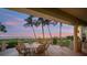 Ocean view patio with seating for six, perfect for sunset dinners at 213 The Esplanade S, Venice, FL 34285