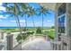 Ocean view patio with stone flooring and balustrade at 213 The Esplanade S, Venice, FL 34285