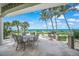 Outdoor patio area features ocean views and seating at 213 The Esplanade S, Venice, FL 34285