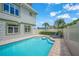 Heated pool with lounge chairs and home exterior view at 213 The Esplanade S, Venice, FL 34285
