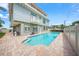 Relaxing heated pool, brick patio, and home exterior view at 213 The Esplanade S, Venice, FL 34285