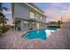 Large heated pool with brick patio and outdoor shower at 213 The Esplanade S, Venice, FL 34285