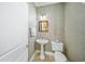 Small powder room with pedestal sink and toilet at 213 The Esplanade S, Venice, FL 34285