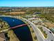 Community overview showing pool, bridge, and clubhouse at 224 Ariano Ave, Nokomis, FL 34275